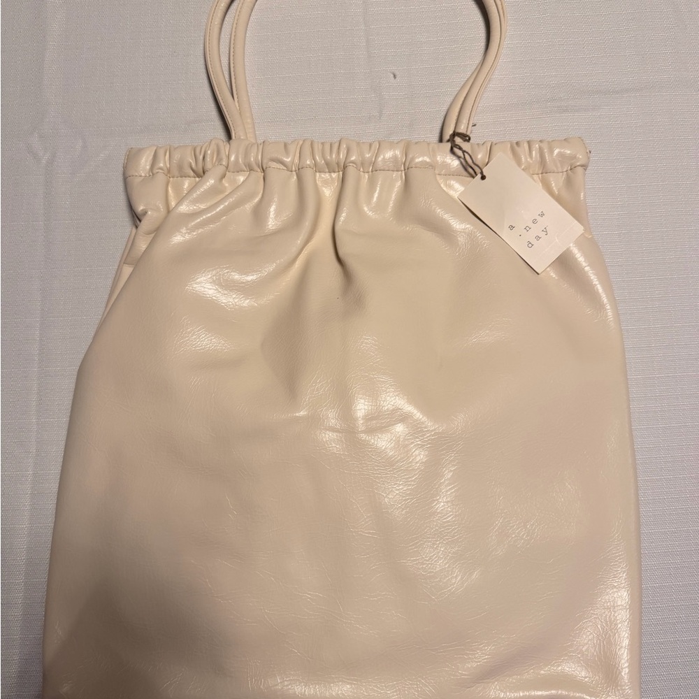 a new day Cream Drawstring Tote Bag